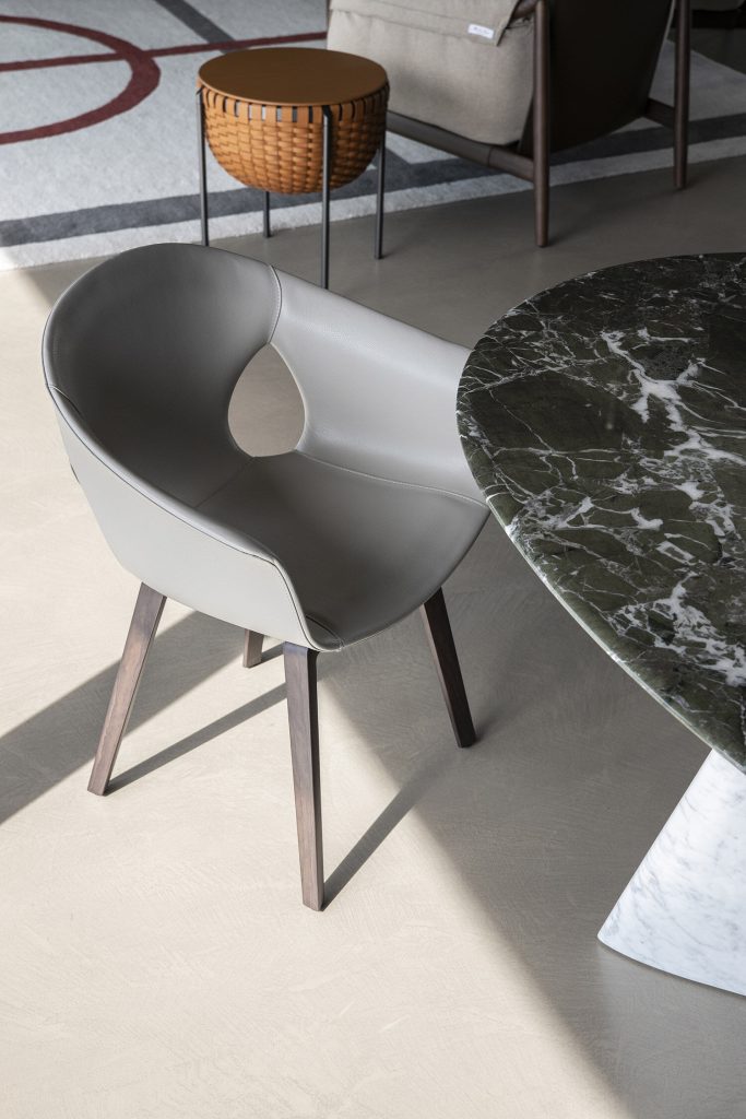 Modern Curved Brown Leather Armchair with Solid Dark Wood Legs Ergonomic Lounge Seat