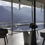 Modern Curved Brown Leather Armchair with Solid Dark Wood Legs Ergonomic Lounge Seat