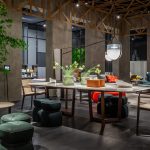 Tan Leather Dining Chair with Dark Wood Frame and Sleek Curved Design