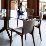 Tan Leather Dining Chair with Dark Wood Frame and Sleek Curved Design
