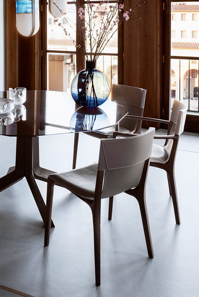 Tan Leather Dining Chair with Dark Wood Frame and Sleek Curved Design