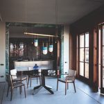 Tan Leather Dining Chair with Dark Wood Frame and Sleek Curved Design