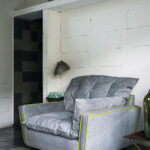 Light Gray Modern Swivel Armchair with Tufted Cushion & Decorative Stitching