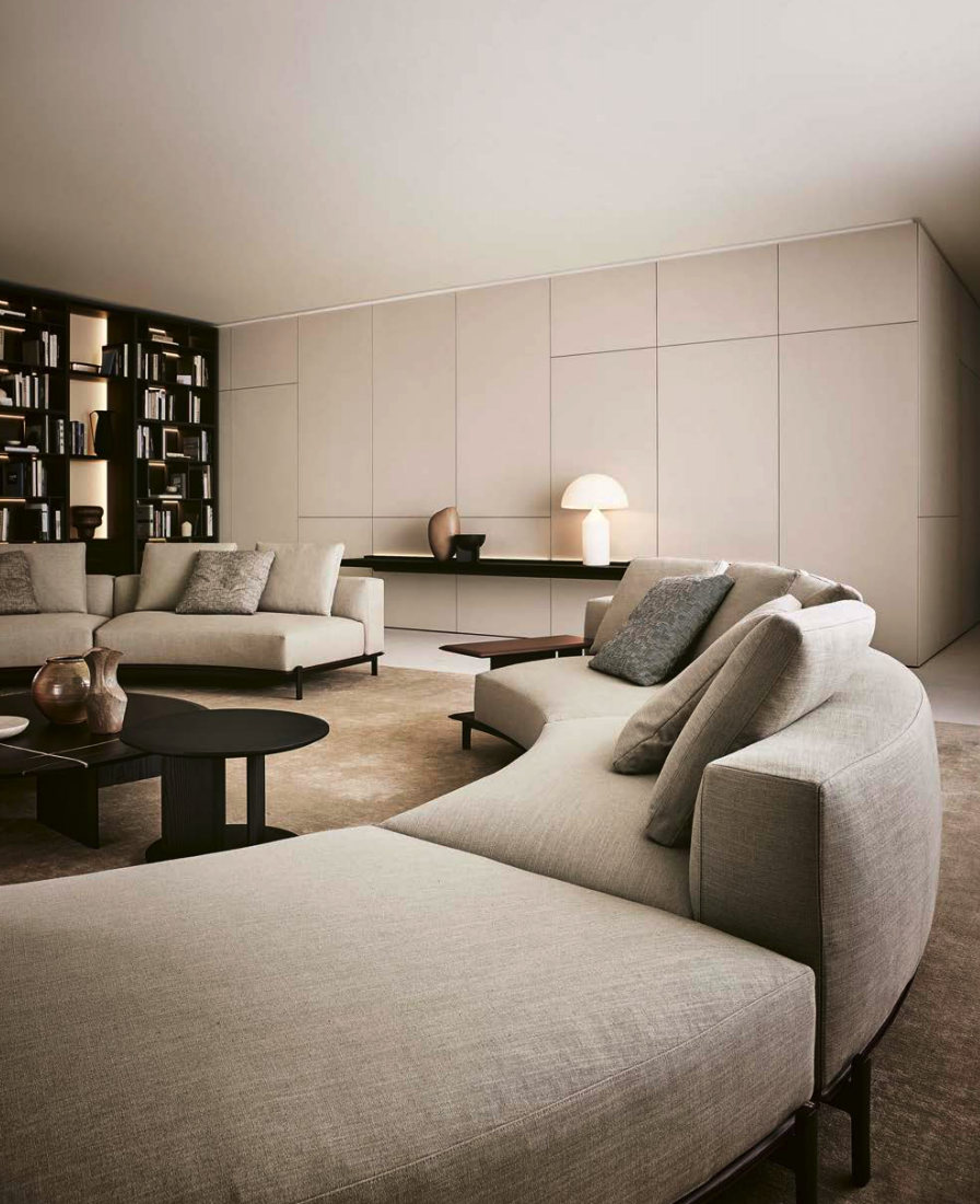 Sculptural Curved Sofa with Leather-Wrapped Base and Contrast Stitch Detailing