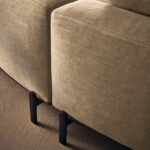 Sculptural Curved Sofa with Leather-Wrapped Base and Contrast Stitch Detailing