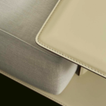 Sculptural Curved Sofa with Leather-Wrapped Base and Contrast Stitch Detailing