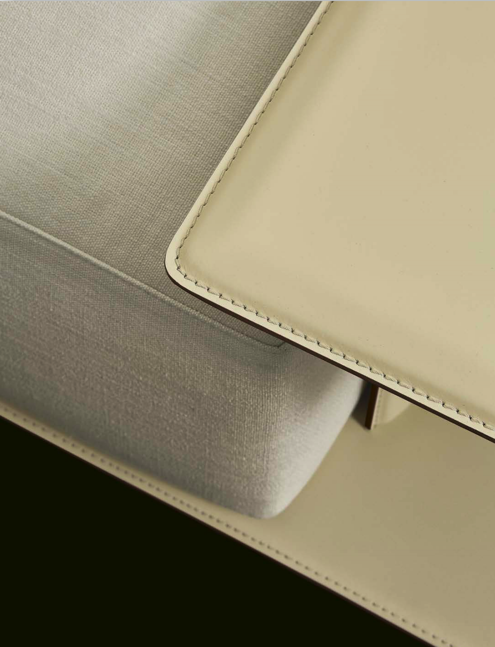 Sculptural Curved Sofa with Leather-Wrapped Base and Contrast Stitch Detailing