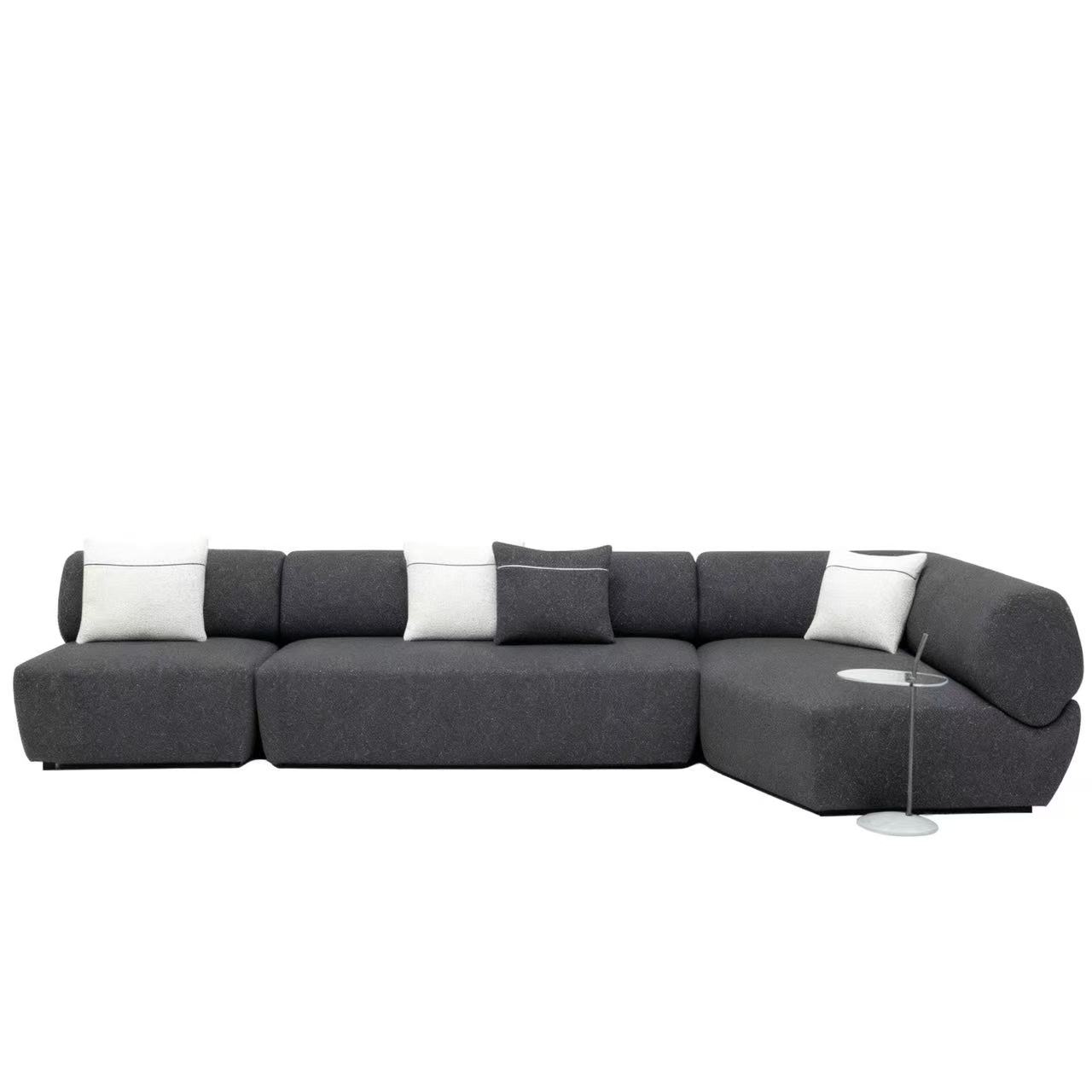 Flowing Modular Sofa with Ergonomic Support and Continuous Decorative Stitch