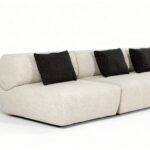 Flowing Modular Sofa with Ergonomic Support and Continuous Decorative Stitch