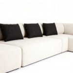 Flowing Modular Sofa with Ergonomic Support and Continuous Decorative Stitch