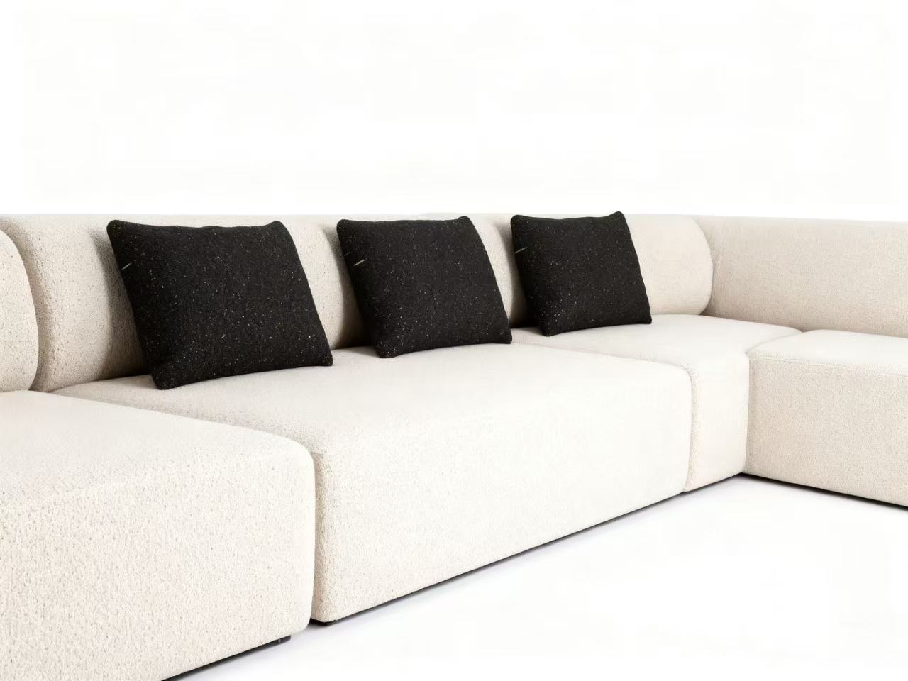 Flowing Modular Sofa with Ergonomic Support and Continuous Decorative Stitch