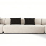 Flowing Modular Sofa with Ergonomic Support and Continuous Decorative Stitch