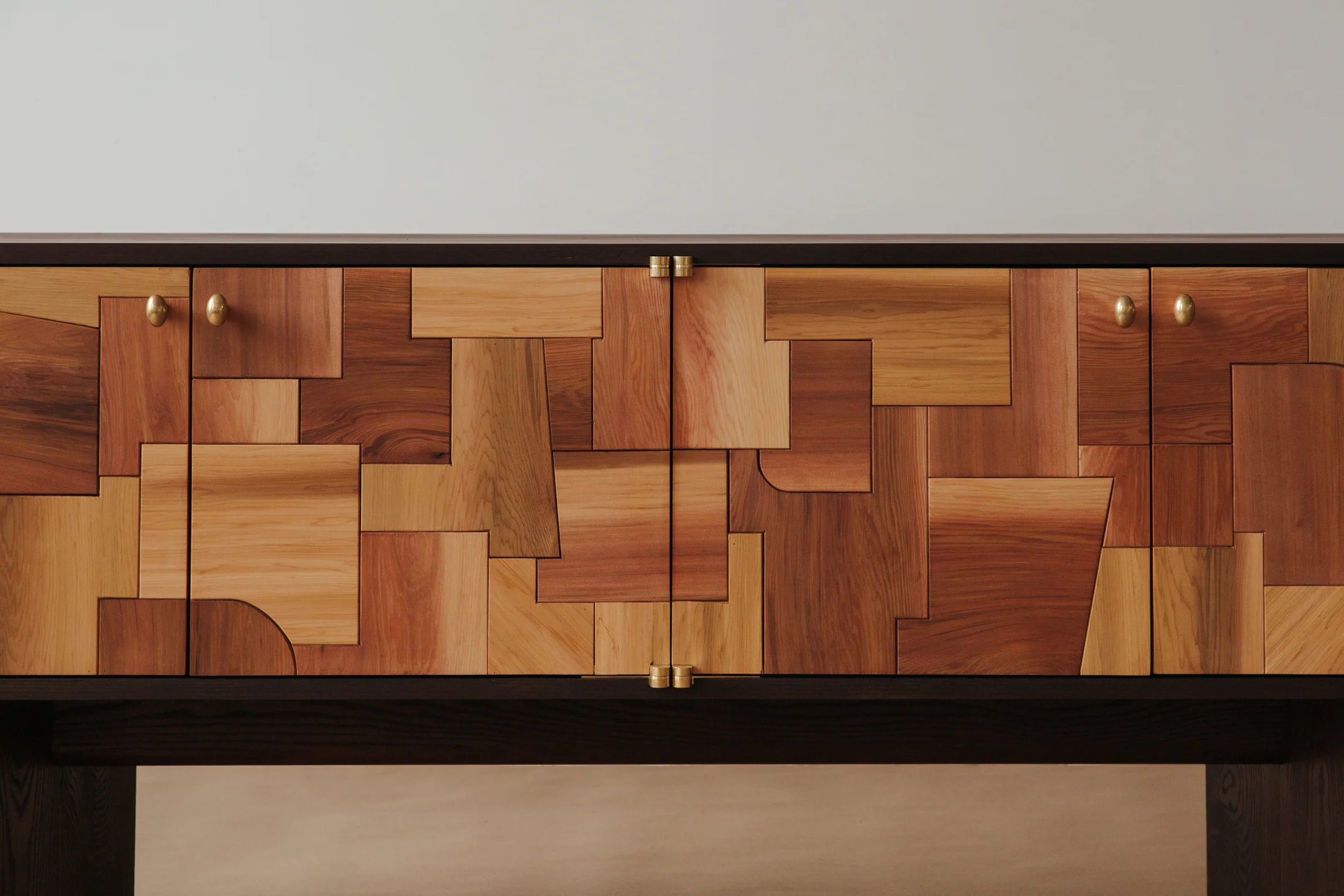 Mixed Wood Patchwork Cabinet Brass Hardware Dark Frame Storage Furniture