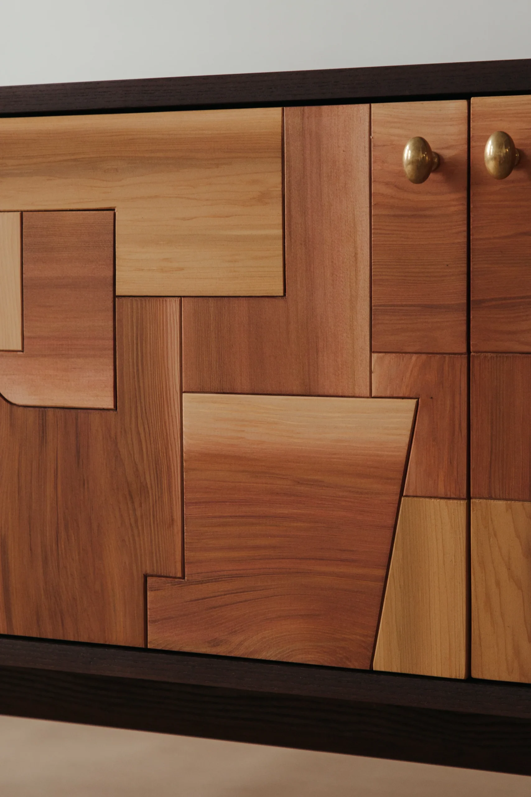 Mixed Wood Patchwork Cabinet Brass Hardware Dark Frame Storage Furniture