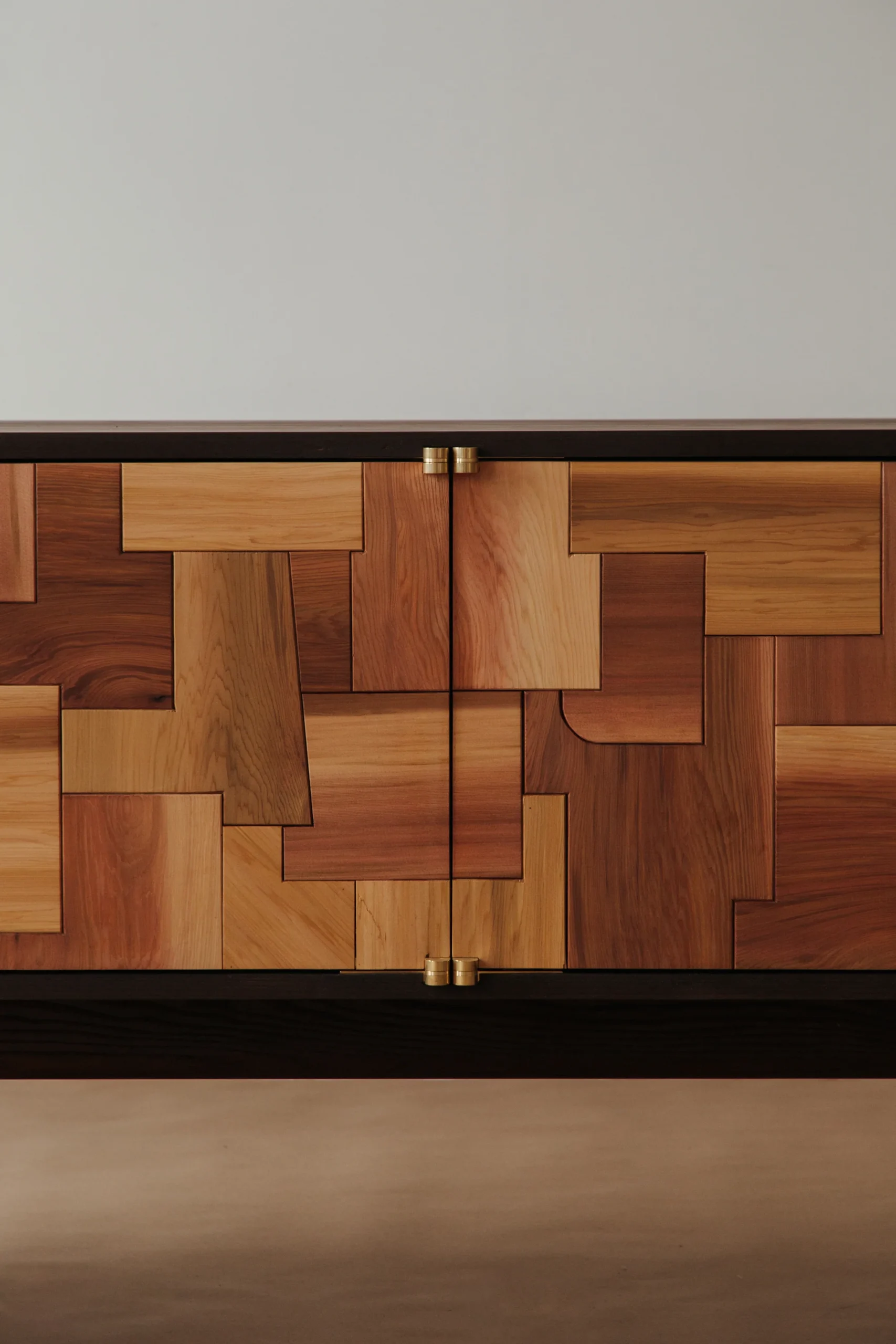 Mixed Wood Patchwork Cabinet Brass Hardware Dark Frame Storage Furniture