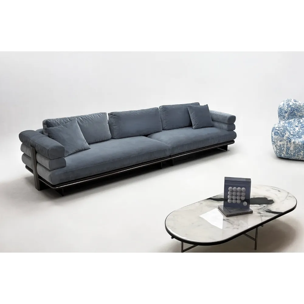 Beige Curved Sofa with Metal Base and Plush Throw Pillows