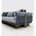 Beige Curved Sofa with Metal Base and Plush Throw Pillows