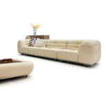 Beige Leather Modular Sofa with Tufted Backrests and Pillows