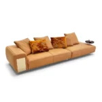 Tan Leather Five Seater Sofa with Metal Accents and Pillows
