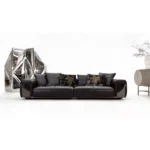 Tan Leather Five Seater Sofa with Metal Accents and Pillows